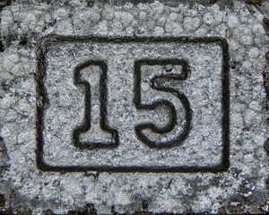 Weight in pounds depicted on a dumbbell