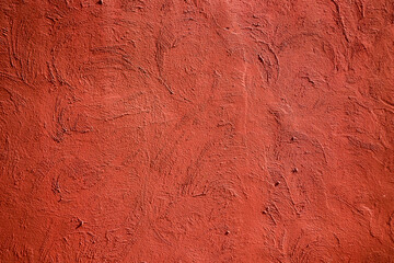 Red cement wall with sunlight