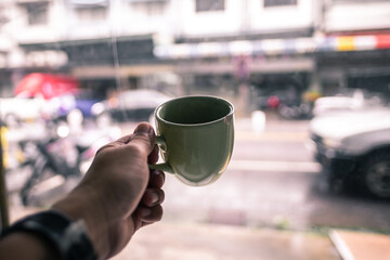 cup of coffee in hand