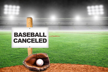 Baseball Canceled Sign on Bat with Glove and Ball in Empty Stadium
