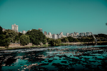 piracicaba river with city in the background and blue sky