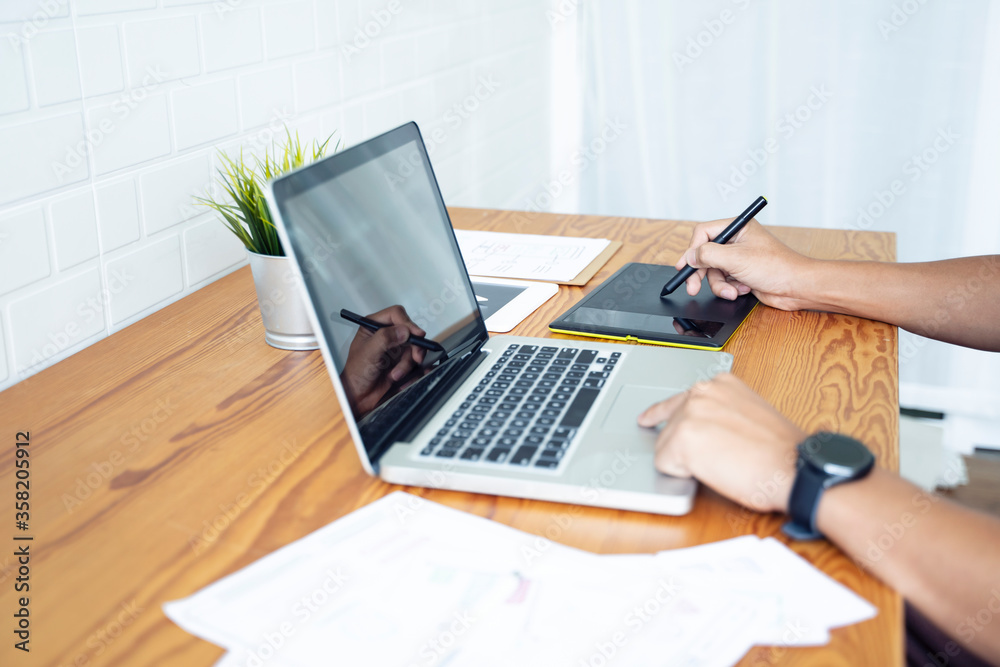 Fototapete Working from home web designing graphical user interface UX UI, home office using computer laptop and pen sketching graphics tablet device creative planning innovative ideas, asian man quarantine