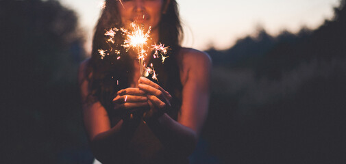 Abstract blur sparklers for celebration background,Motion by wind blurred woman hand holding...