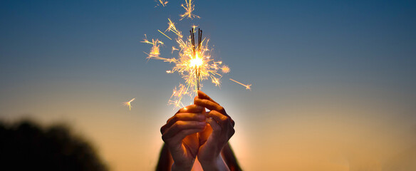 Abstract blur sparklers for celebration background,Motion by wind blurred woman hand holding...