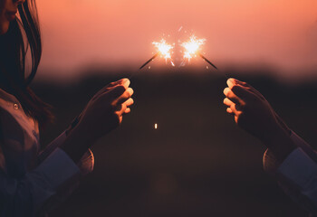 Abstract blur sparklers for celebration background,Motion by wind blurred woman hand holding...