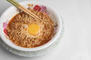 A serving of instant noodles with an egg,shot from top angle,food photography concept
