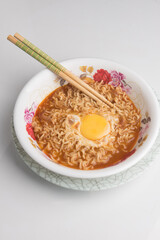A serving of instant noodles with an egg,shot from top angle,food photography concept