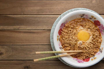 A serving of instant noodles with an egg,shot from top angle,food photography concept