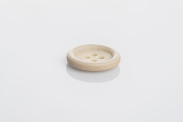 A white button isolated over white background