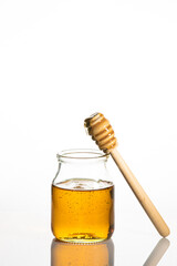 jar of honey and toothpick