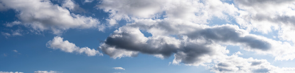clouds in the sky making shapes and drawings with various colors