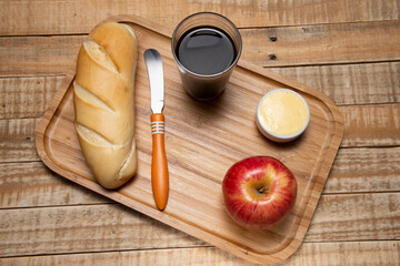 simple breakfast, with bread and butter, coffee and fruit