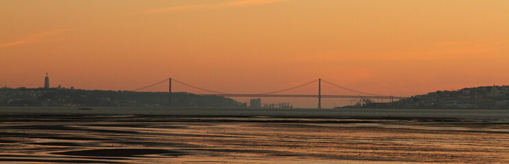 Fototapeta na wymiar sunset over the 25 April Bridge in Lisbon/Portugal