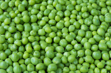 Green peas close-up, top view. Background of green peas. Proper nutrition. The concept of vegetarianism.