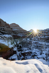 Fototapeta na wymiar Sunrising on Capitaldome covered by snow at Capitol Reef National Park
