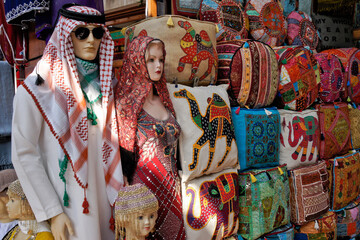 Colorful handicrafts and clothing for sale in textile souk, Bastakia Quarter, Old Dubai, United Arab Emirates