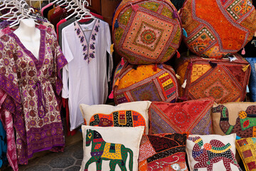 Fototapeta premium Colorful handicrafts and clothing for sale in textile souk, Bastakia Quarter, Old Dubai, United Arab Emirates