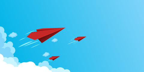 Fototapeta premium Red paper airplanes flying on blue sky.Business teamwork and leadership concept.