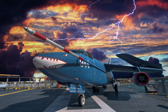 Historic jet on flight deck of aircraft carrier with storm raging in background as lighting strikes composite image moody powerful striking concept freedom and strength.