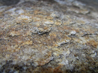 mica rock texture with bronze tones depth of field