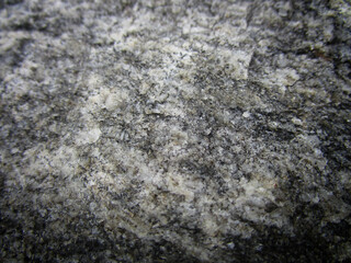 grey rock texture with mica extreme close up