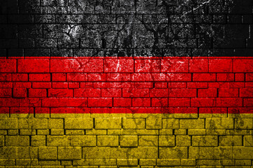 National flag of Germany on brick  wall background.The concept of national pride and symbol of the...