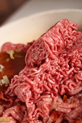 Adding ground meat into frying pan. Making Lasagna Bolognese Series.