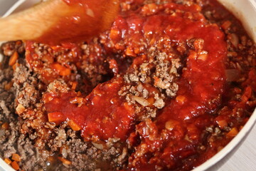 Mixing tomato paste and minced meat. Making Lasagna Bolognese Series.