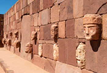 Carved stone head sculptures in the semi subterranean courtyard temple in Tiwanaku, La Paz, Bolivia.