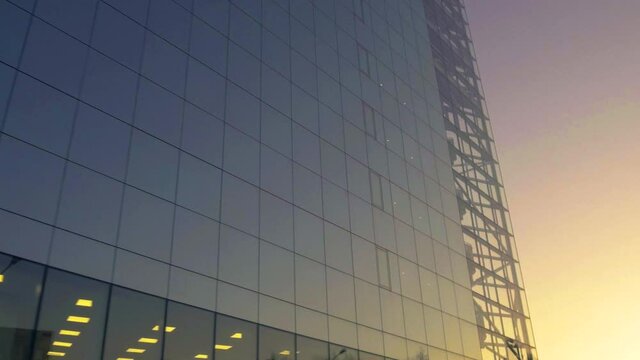 Sunrise Reflection In Glass facade of Modern Urban office Skyscraper