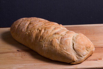 Homemade wholegrain rye bread on wooden cutting Board.