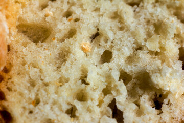 Macro photography of a slice home-baked bread. Texture or background