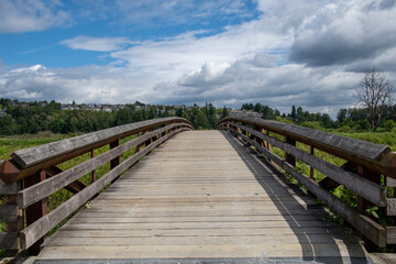 Obraz premium Wooden bridge at Colony Farm Regional Park. BC Canada 