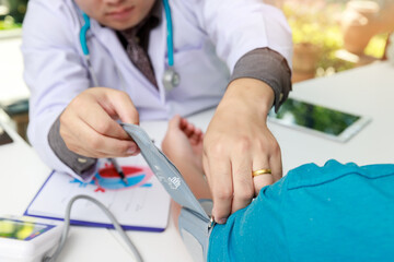 Doctor measuring blood pressure of the patient in the hospital, Medical and health care concepts.