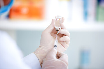 A close-up picture of a male doctor holding a syringe with vaccination, influenza medicine, male doctor, insulin, health concepts, influenza drugs