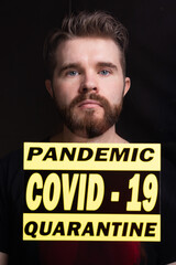 Coronavirus, quarantine, covid-19 and pandemic concept. Sad and sick man of coronavirus looking through the window.