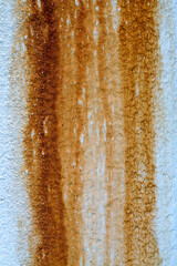 Close-up of rust on the cement wall