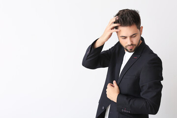 Handsome man with stylish hairdo on white background