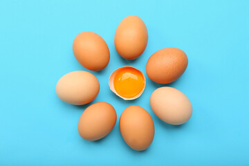 Fresh chicken eggs on color background