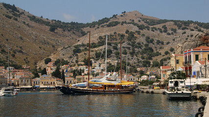 Fototapeta na wymiar Symi town, Symi island, pictorial view of colorful houses and the harbour
