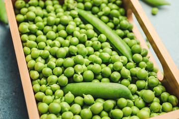 Box with tasty fresh peas, closeup