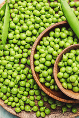 Plate and bowls with tasty fresh peas, closeup