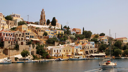 Fototapeta premium Symi town, Symi island, pictorial view of colorful houses and the harbour