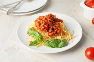 Plate with tasty pasta bolognese on table
