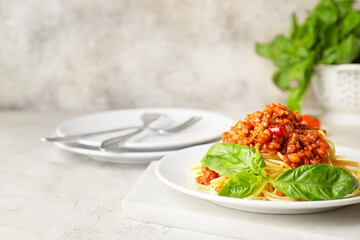Plate with tasty pasta bolognese on table