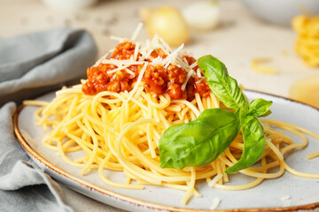 Tasty pasta bolognese on plate, closeup