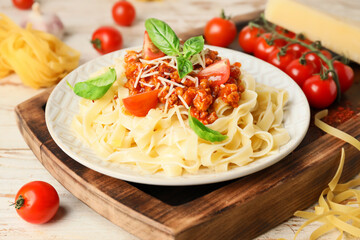 Plate with tasty pasta bolognese on table