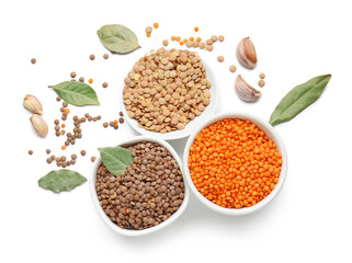 Bowls with lentils and spices on white background