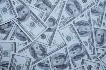 Group of money stack of 100 US dollars banknotes a lot of the background texture top view