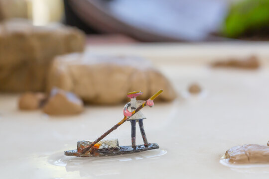 Miniature Chinese traditional fisherman punting